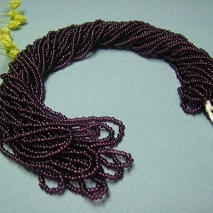 One hank of Czech Transparent Deep Amethyst seed beads 0704 size 11 image 1