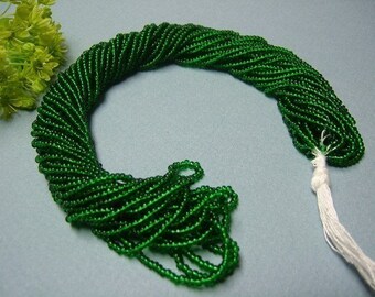One hank of Czech Transparent Christmas Green seed beads - 0406 size 11