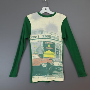 May include: A distressed wooden sign with the words "Welcome to our home" in white. The sign has a rustic finish, ideal for adding a welcoming touch to any home's entrance.