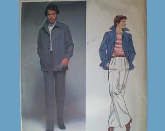 May include: A Vogue Paris Original sewing pattern envelope, number 1609, featuring Christian Dior designs. The cover displays a photograph of a person in a grey jacket and trousers, alongside an illustration of a person in a blue jacket and striped shirt.