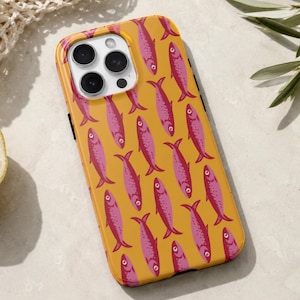 Tough iPhone case with a glossy finish featuring a repeating pink sardine pattern on a warm mustard yellow background.
