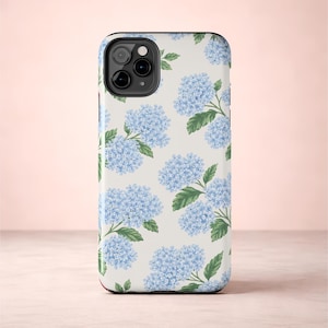 May include: A set of three ceramic mugs with a speckled, matte finish. The mugs are in shades of cream, light gray, and dark gray. Each mug has a simple, minimalist design, perfect for coffee or tea.