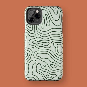 May include: A smartphone case with a topographic map design. The case features a light green background with dark green contour lines. The case has a glossy finish and a black camera module.