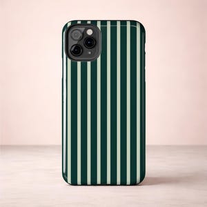 Glossy iPhone case with deep forest green and light green vertical pinstripes giving it a classic preppy style