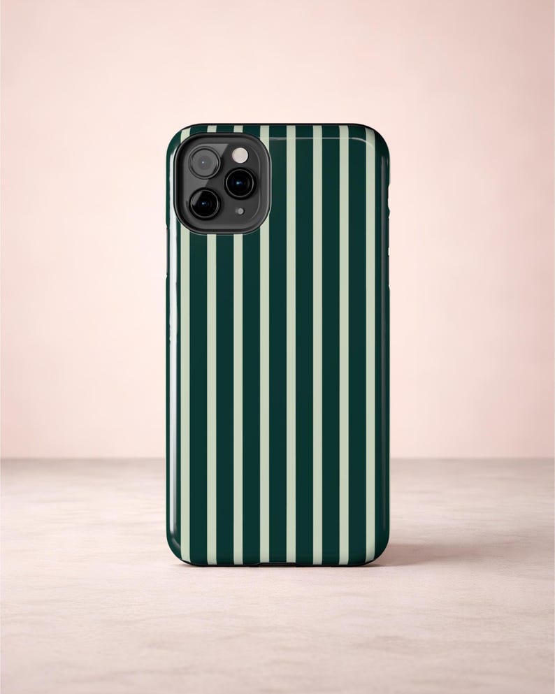 Glossy iPhone case with deep forest green and light green vertical pinstripes giving it a classic preppy style