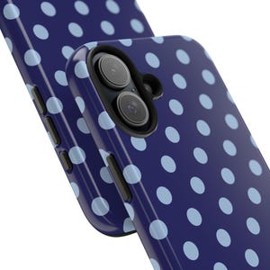 Phone case with light blue polka dots on a navy background in a minimalist preppy design