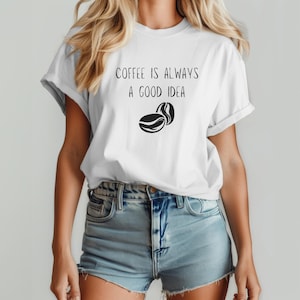 May include: White t-shirt with the text "Coffee is always a good idea" and a black coffee bean graphic.