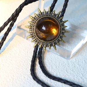 Ruby Color Bolo Tie: Bronze Western Slide, Gold & Black Leather Cord
