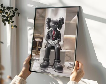 May include: A black and white figurine of a character wearing a suit and tie, sitting on a white chair. The character has a large head with an X pattern on the forehead. The figurine is in a modern, minimalist setting.