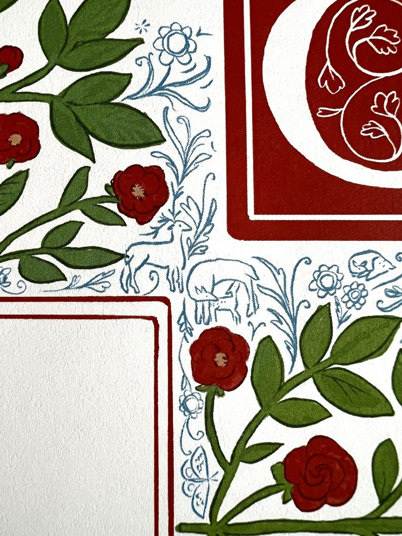 May include: Close-up of a decorative illustration with a white background. Features red roses, green leaves, and blue floral and animal motifs. A red border frames a white space, and a large red letter is visible.
