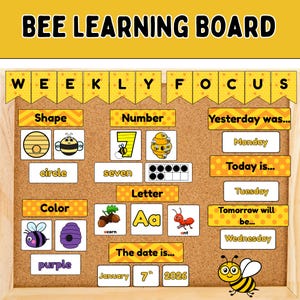 May include: A wooden framed "BEE LEARNING BOARD" with educational elements. Includes sections for shape, number, color, and letters. Features a bee graphic and the text "WEEKLY FOCUS". Displays days of the week and the date: January 7th, 2026.