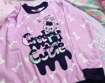 Maglione orsetto spaventoso e carino con emozioni inquietanti.