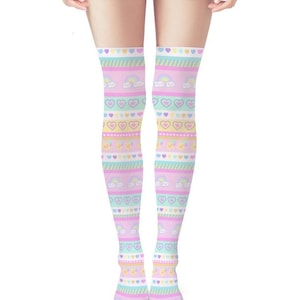 May include: Over-the-knee socks with a pastel rainbow, heart, and cloud pattern. The socks feature stripes of pink, yellow, and blue, with repeating heart and cloud motifs. The socks are designed to be worn on the legs.
