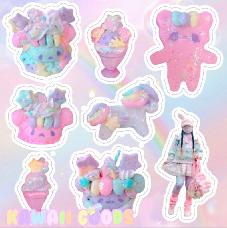 May include: A set of colorful, whimsical stickers featuring a unicorn, a bear, a cupcake, and a character with a rainbow-colored head. The stickers are decorated with glitter, stars, and other cute details. The text "Kawaii Goods" is visible at the bottom of the image.