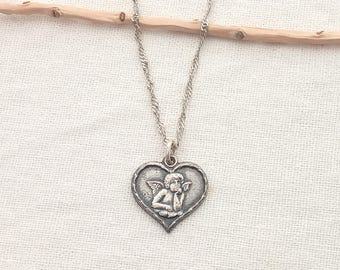 Heart jewelry. Vintage Sterling Silver heart angel necklace