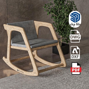 Peut inclure: Un fauteuil &agrave; bascule en bois clair avec une assise et un dossier rembourr&eacute;s gris. La structure pr&eacute;sente des patins incurv&eacute;s et des accoudoirs int&eacute;gr&eacute;s. Des ic&ocirc;nes de fichiers skp, DWG, DXF et PDF ainsi que le texte pikus.shop sont visibles.