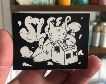 Sleep Cat with Little House Vinyl Sticker by Deth P. Sun