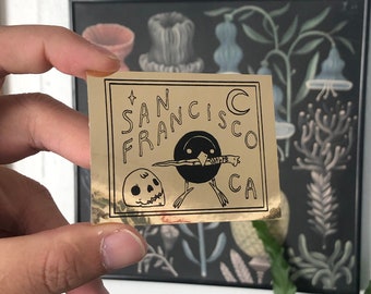 San Francisco Bird with Knife Black on Gold Foil Sticker by Deth P. Sun