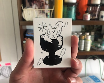 Cat in Goblet Vinyl Sticker by Deth P. Sun