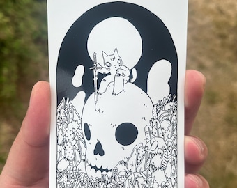 Cat Sitting on Skull Vinyl Sticker by Deth P. Sun