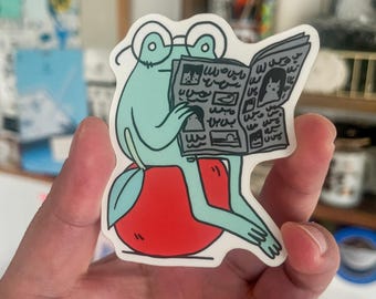 Frog Reading Newspaper on Apple Vinyl Sticker