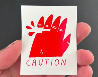 Caution Injured Hand Sticker by Deth P. Sun