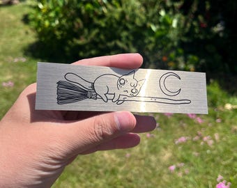Gold Foil Cat Riding Broom Sticker by Deth P. Sun