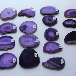 May include: Fifteen purple agate slices with white numbers from 34 to 48 on each slice.