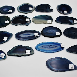 May include: Assortment of 15 blue agate slices, each with unique banding patterns. The slices are numbered 171 through 185.