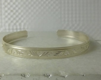 Heart and Flourish patterned sterling silver cuff bracelet in three sizes, from the Love Collection