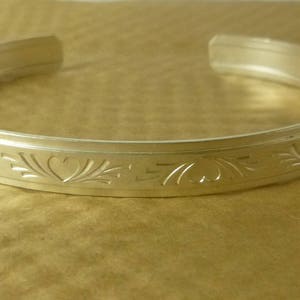 Heart and Flourish patterned sterling silver cuff bracelet in three sizes, from the Love Collection image 5