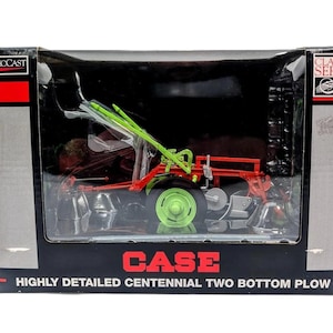 May include: A SpecCast Classic Series model of a Case highly detailed centennial two bottom plow in a black box. The toy features a bright red frame, a lime green wheel, and silver-colored plow components, all visible through the clear plastic window.