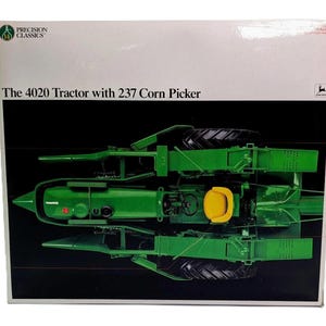 May include: A white rectangular product box featuring a top-down view of a green John Deere 4020 tractor with a 237 corn picker attachment. The box displays the text The 4020 Tractor with 237 Corn Picker and the Precision Classics logo.