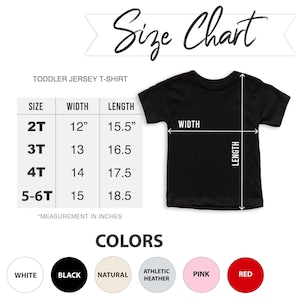 May include: A black toddler jersey t-shirt with a size chart. The chart lists sizes 2T to 5-6T, with width measurements from 12" to 15" and lengths from 15.5" to 18.5". Color options include white, black, natural, athletic heather, pink, and red.