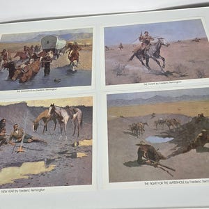 May include: Four framed prints of Western scenes by Frederic Remington. The prints depict cowboys, horses, and wagons in various settings, including a river crossing and a desert landscape. The prints are in a white frame.