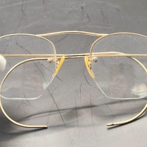 May include: A set of three ceramic mugs with a speckled, matte finish. The mugs are in shades of cream, light gray, and dark gray. Each mug has a simple, minimalist design, perfect for coffee or tea.