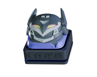 May include: A futuristic-looking, dark gray and blue device with a stylized robot head design. The head has angular features, white accents, and glowing yellow and red lights. The base is black with the word "ARKE" in white.