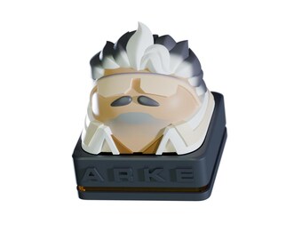 May include: A custom keycap featuring a stylized face with a white and gray hairstyle, a mustache, and a beige face. The keycap is set on a dark gray base with the letters "ABKE" and a gold accent.
