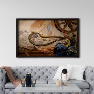 May include: A framed painting depicting a surreal scene with a clock melting into a snake, a figure holding a wheel, and a background of gold coins. The painting is set against a white wall and a gray sofa with a throw pillow.