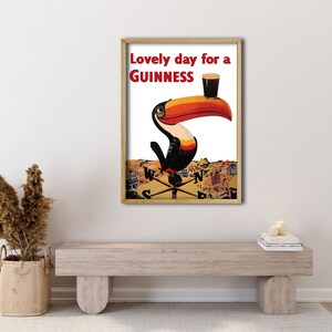 May include: A vintage Guinness advertisement featuring a toucan holding a glass of Guinness with the text "Lovely day for a GUINNESS".