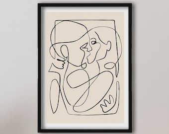 May include: A framed wall art print featuring a black continuous line drawing of two figures embracing on a light beige background. The artwork is enclosed in a simple black rectangular frame, showcasing an abstract depiction of two faces.