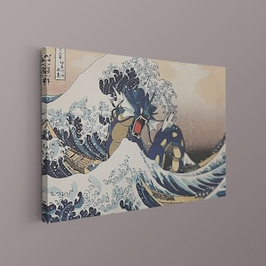 May include: A rectangular canvas print featuring a stylized illustration of a blue sea serpent creature emerging from a large, crashing ocean wave. The artwork incorporates traditional Japanese woodblock print aesthetics with dark blue and cream tones, including vertical Japanese text in the upper left corner.