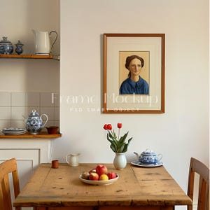 May include: A wooden table with a white pitcher, a bowl of apples, a teapot, and a vase of red tulips. A framed portrait of a woman in a blue dress hangs on the wall behind the table.