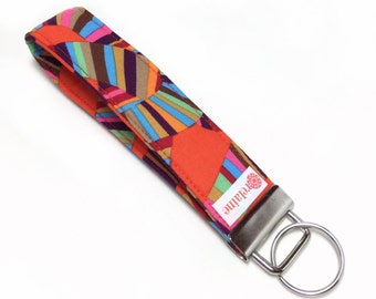 Orange swirl ribbon keychain, key fob, key wristlet, key holder, key chain.  Kaffe Fassett roller coaster fabric.