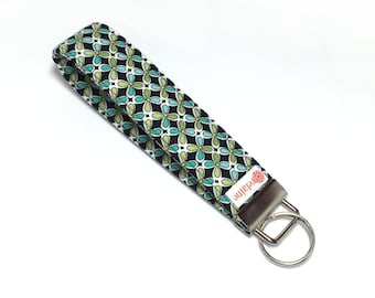 Green and turquoise keychain, key fob, key wristlet, key holder, key chain.  Flowers on black fabric.  Fabric keychain wristlet.