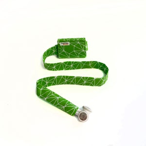 Green and white abstract TuneTube.  Earbud cord organizer for iPhone or iPod.  Cord keeper.  Earbud holder.  Earbud case.