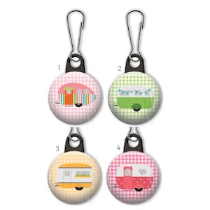 May include: Four zipper pulls with different colored and patterned camper vans on a white background. The zipper pulls are numbered 1 through 4.
