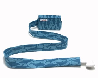 Blue shark TuneTube.  Earbud cord organizer for iPhone or iPod.  Cord keeper.  Earbud holder.  Earbud case.