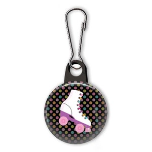 May include: A white roller skate with pink wheels and colourful laces on a black background with colourful polka dots. The skate is attached to a black zipper pull.