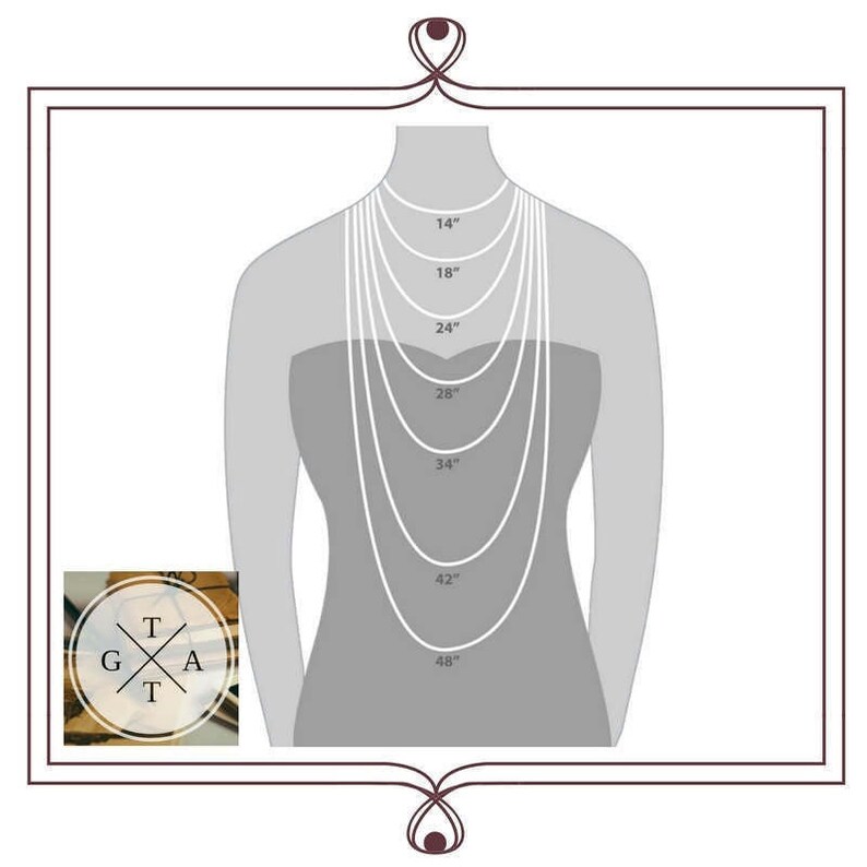 May include: A diagram showing different necklace lengths from 14 inches to 48 inches. The lengths are marked on a silhouette of a person wearing the necklaces.